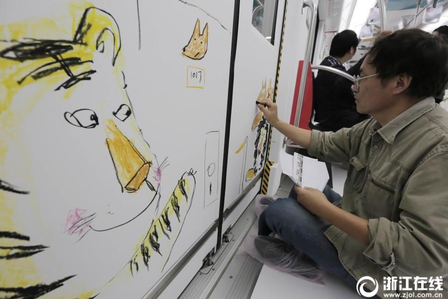 Illustrators paint subway cars in Hangzhou