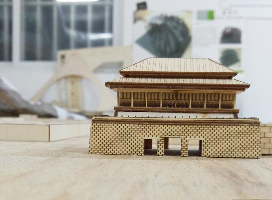 College students miniature Palace Museum on a wooden board