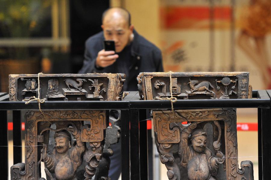 Exhibition of ancient Chinese architectural woodcarving components kicks off in Jinan