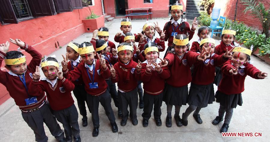 Children celebrate Holi festival in Kathmandu