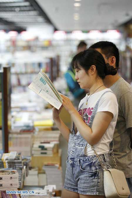 Residents read books at 24-hour bookstore in Beijing