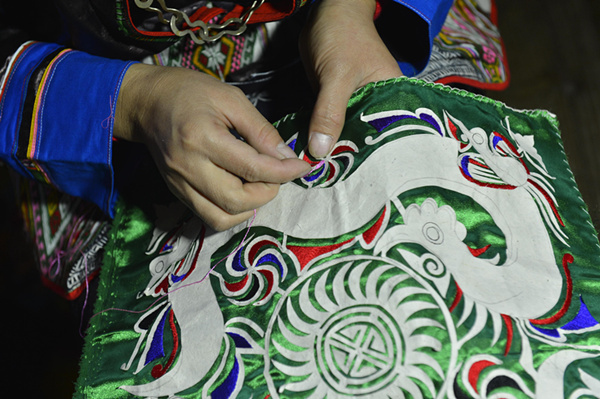 Jiang Laoben and her exquisite craftsmanship of Miao's 'hundred-bird dress'