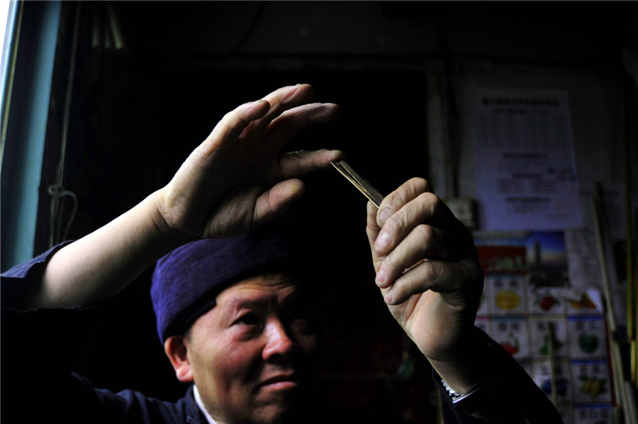 Inheritor of reed-pipe wind instrument 'Lusheng' in Guizhou