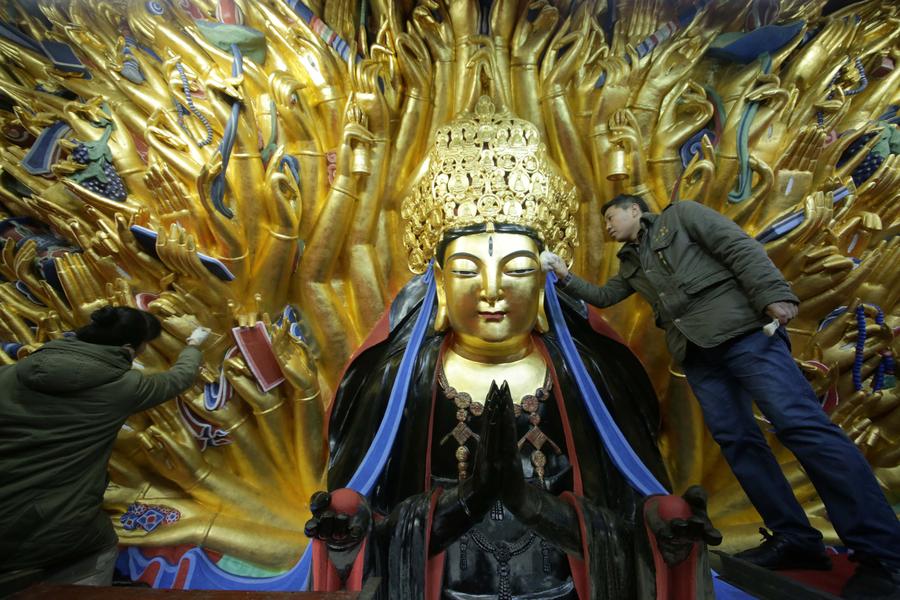 Repair of Dazu Thousand - Hand Kwan-yin statue to finish
