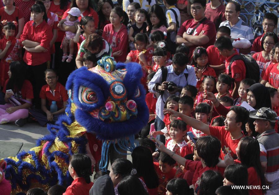 Lion dancers perform at Indonesian Chinese school for Chinese Lunar New year