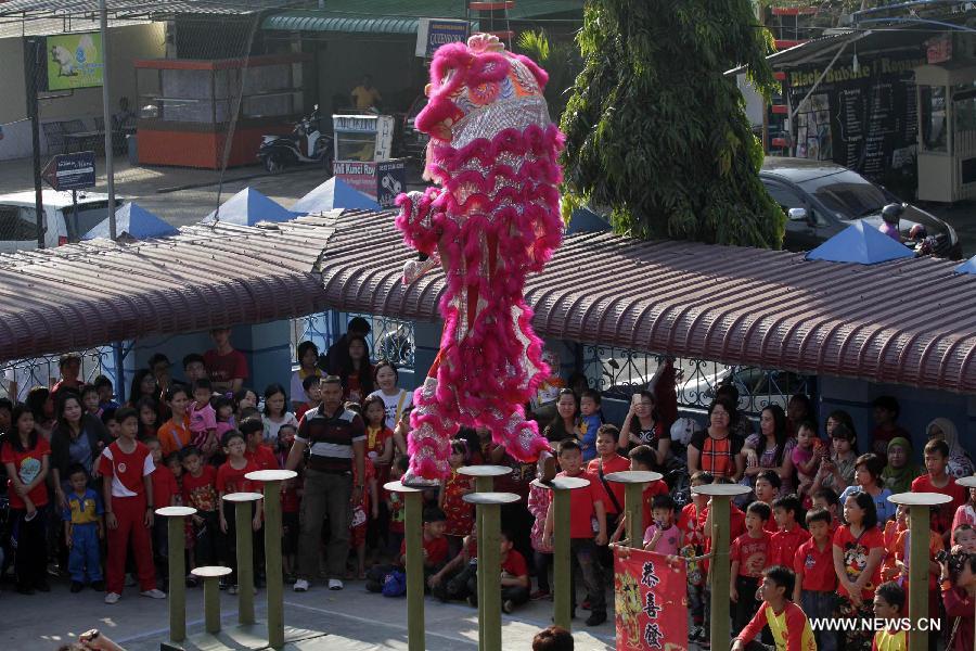 Lion dancers perform at Indonesian Chinese school for Chinese Lunar New year