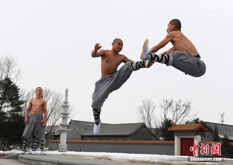 Monks practice Shaolin kung fu