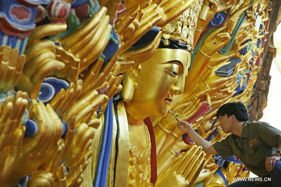 Restoration work of Guanyin sculpture enters final phase