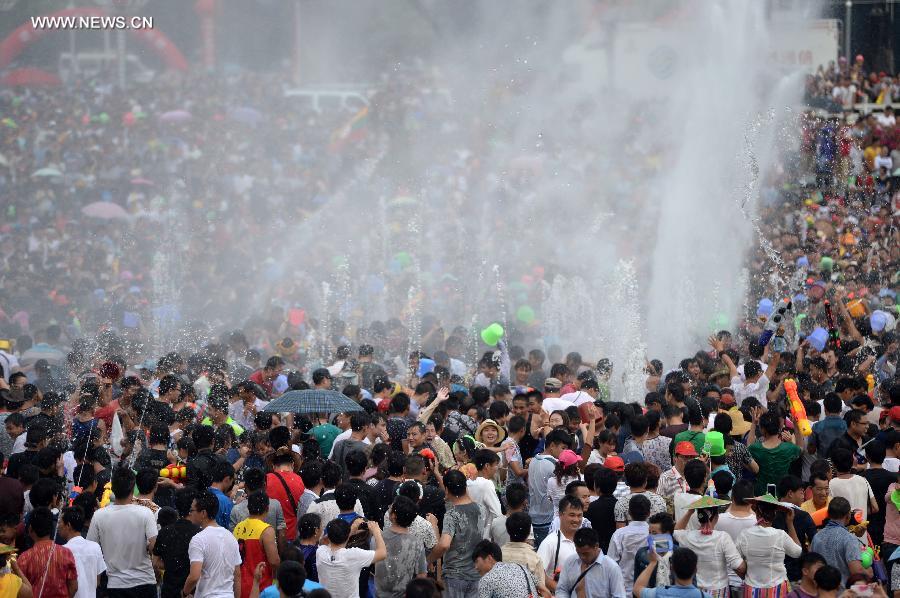 Water-sprinkling festival kicks off in SW China