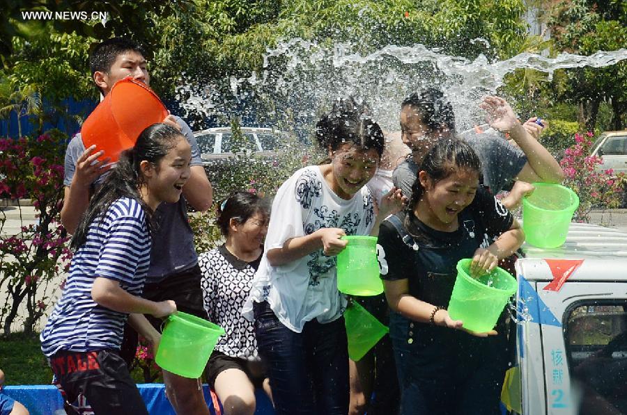 Water-sprinkling festival kicks off in SW China