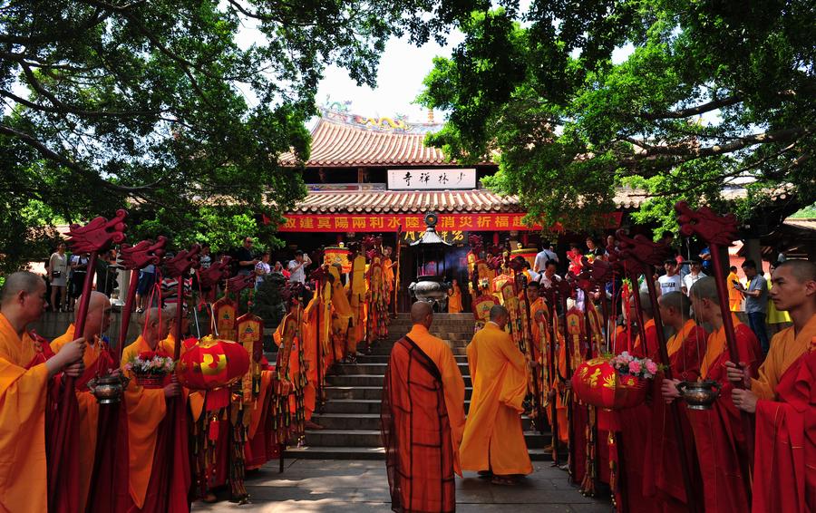 Monks practice martial art at Quanzhou Shaolin Temple