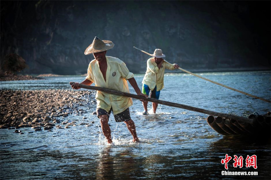 Rafters on Jiangxi's Luxi River depend on tourism