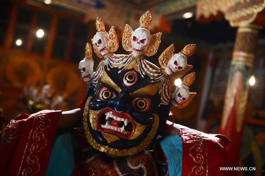 Monks wearing masks rehearse Gesar opera at Chalang Temple in NW China
