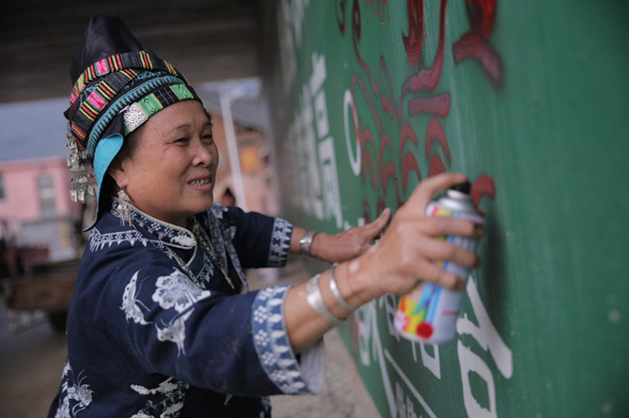 Miao people celebrate as old art meets new medium
