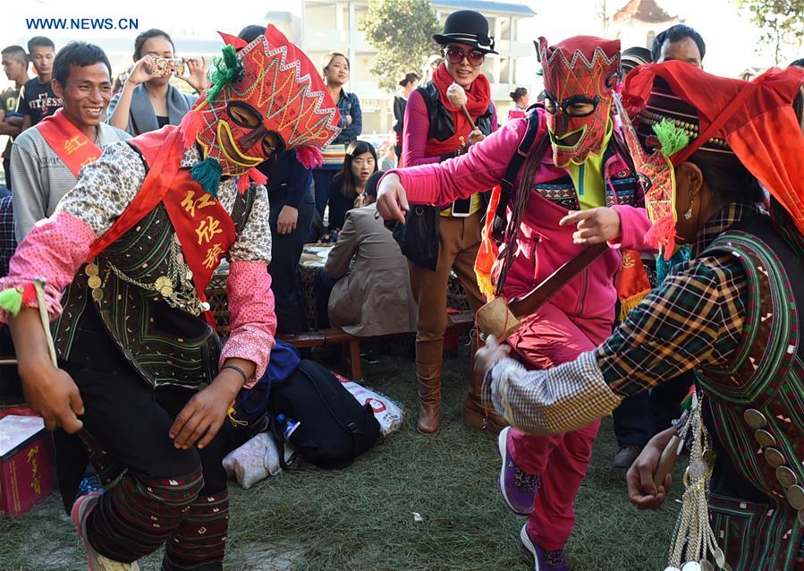 Locals enjoy themselves during traditional festival in Yunnan