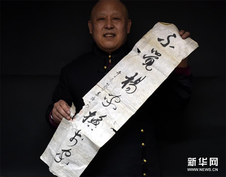 Inheritor restores classic painting and calligraphy