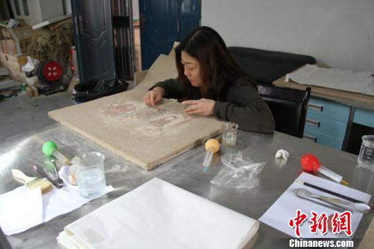 Ancient Dharmago murals restored in Xinjiang