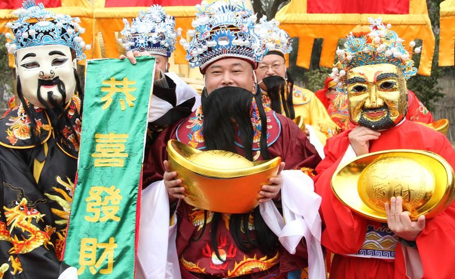 People welcome 'God of Wealth' to mark Spring Festival