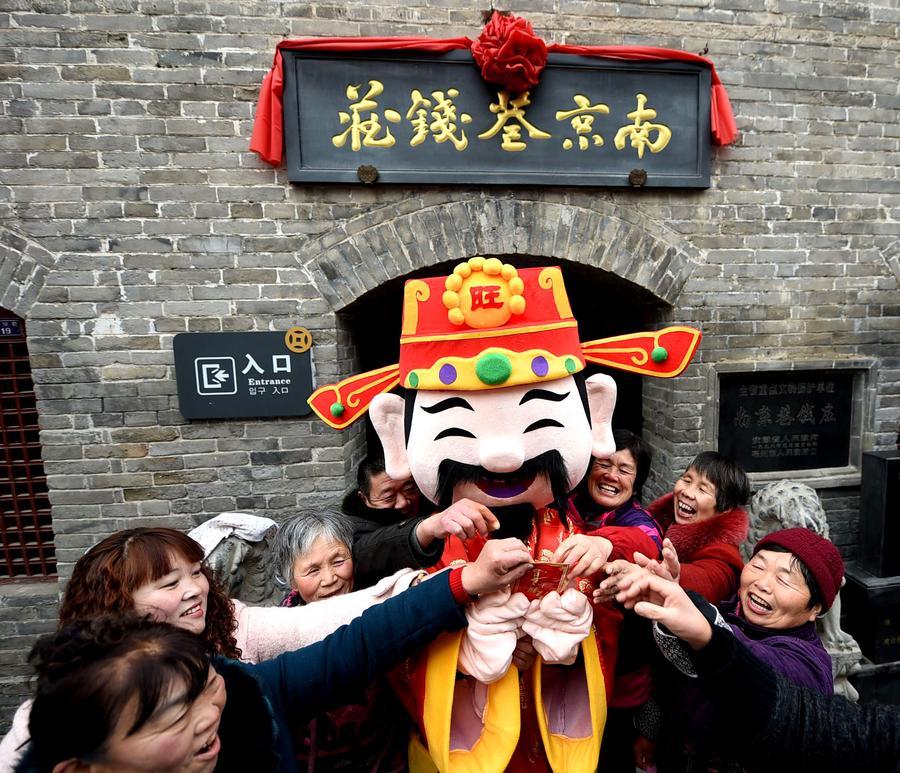 People welcome 'God of Wealth' to mark Spring Festival