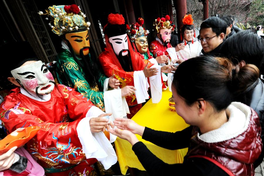 People welcome 'God of Wealth' to mark Spring Festival