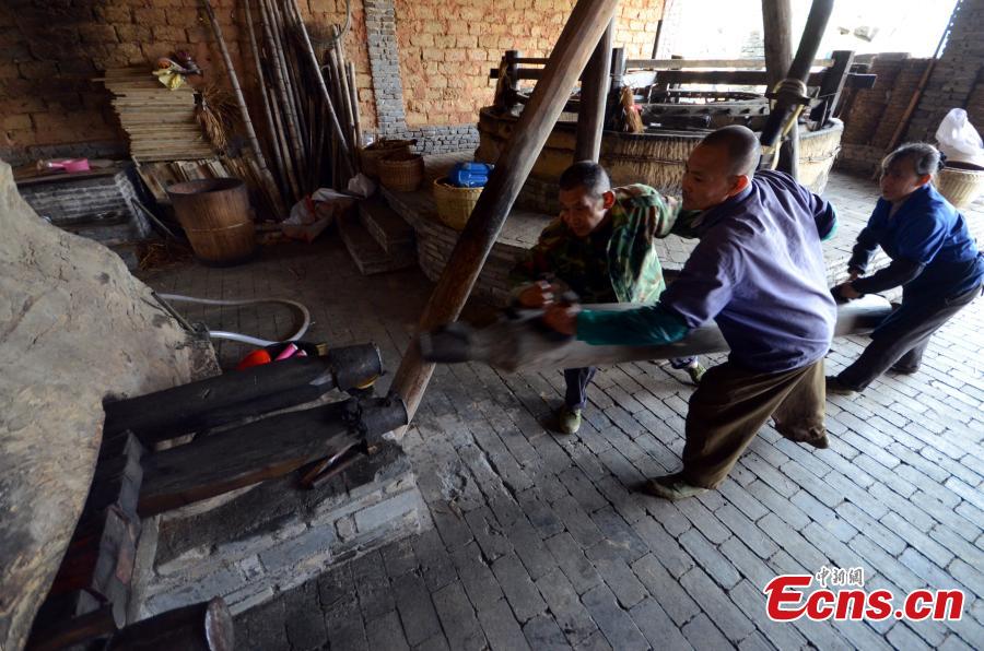 Century-old mill yields camellia oil the old-fashioned way