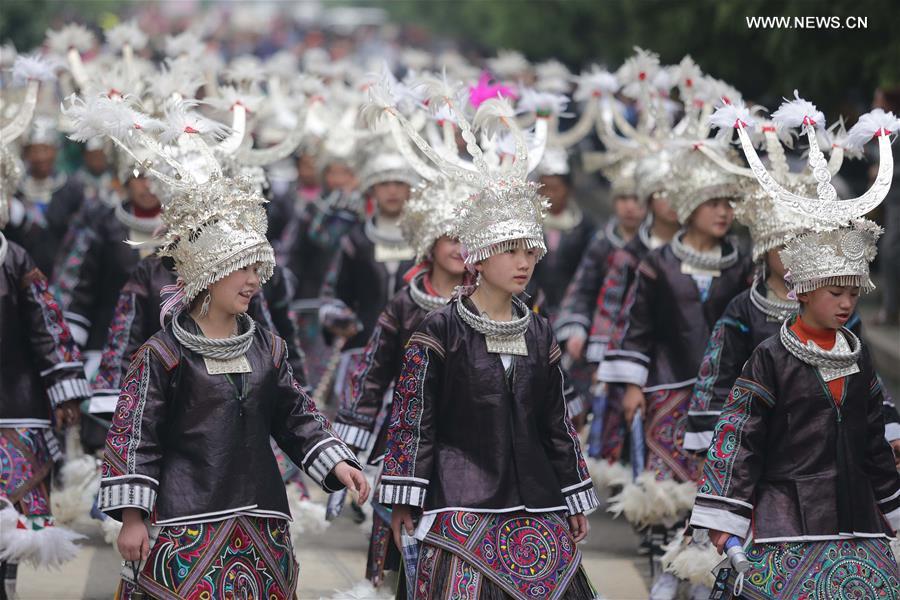 Traditional costumes of Miao ethnic group displayed on parade show in Southwest China