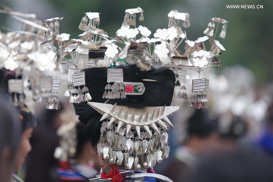 Traditional costumes of Miao ethnic group displayed on parade show in Southwest China