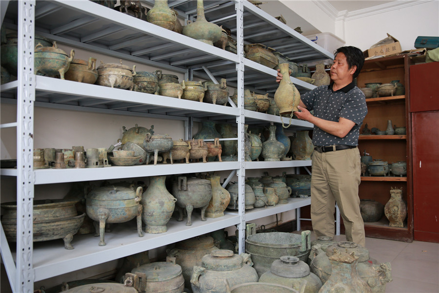 Restorers revive ancient bronze ware in C China