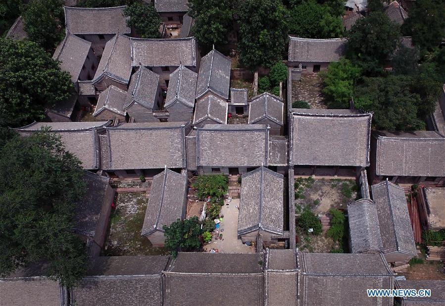 Linfeng village features complex built with red rocks in Henan