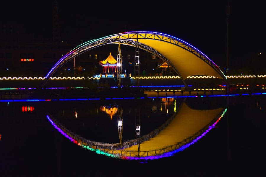 Vibrant night cityscape of Gansu's Dunhuang city