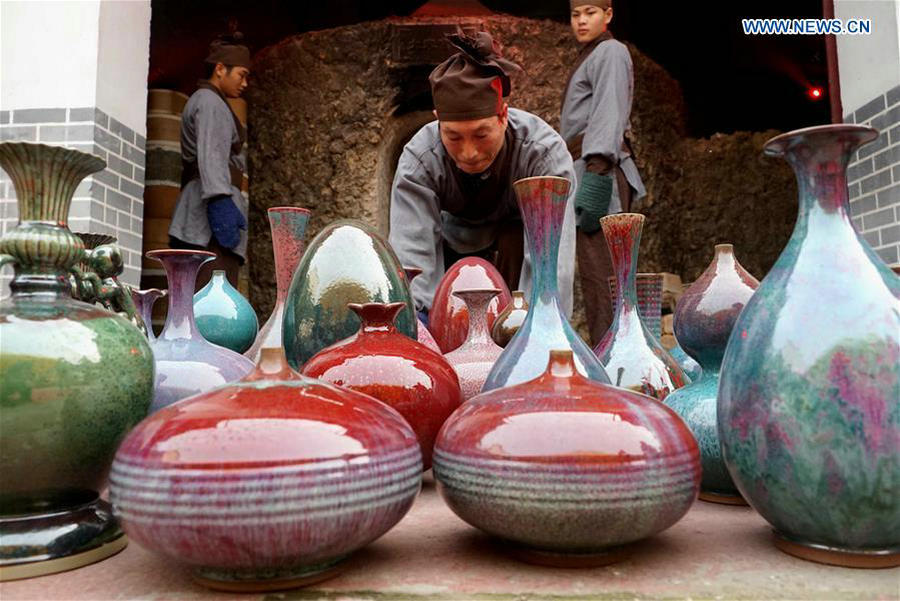 Ceremony taking porcelains out of kiln held in central China