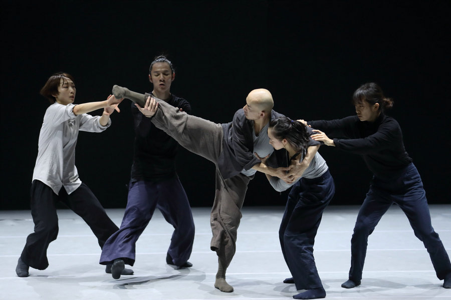 Modern dance performance represents human relationships