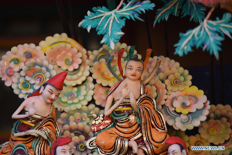 Butter sculptures of Buddha figurines exhibited at Taer Monastery