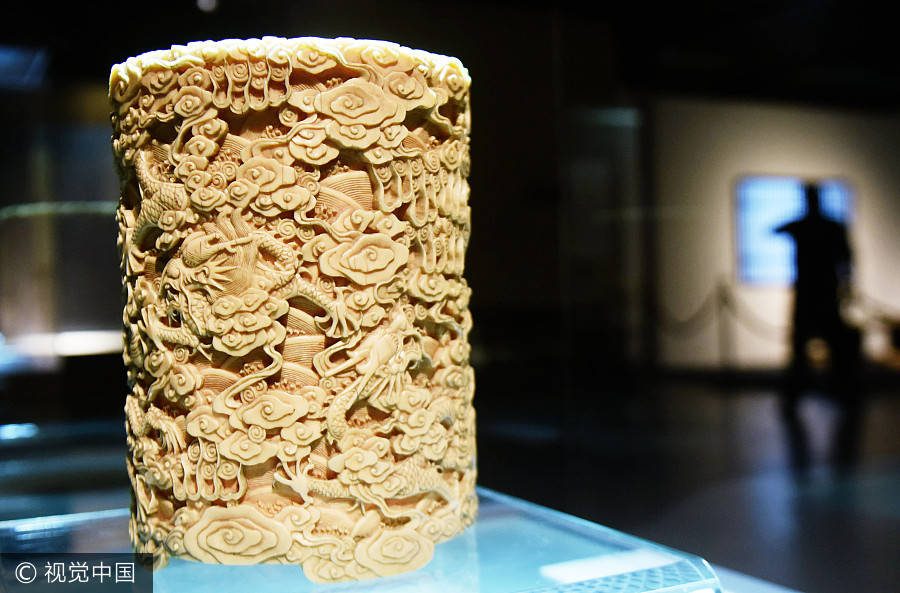 Cute carved artifacts on display in E China