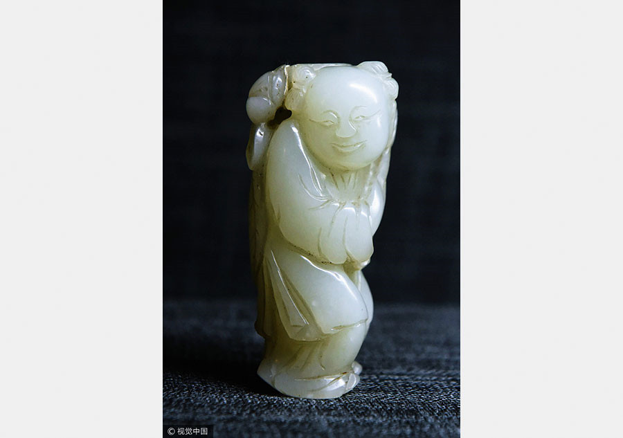 Cute carved artifacts on display in E China