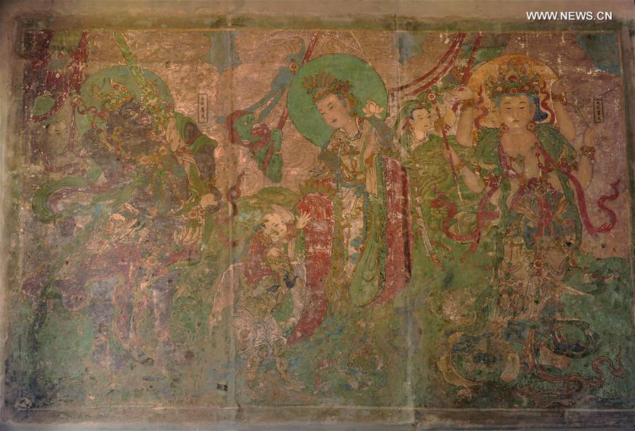 Experts restore ancient murals at temple in N China