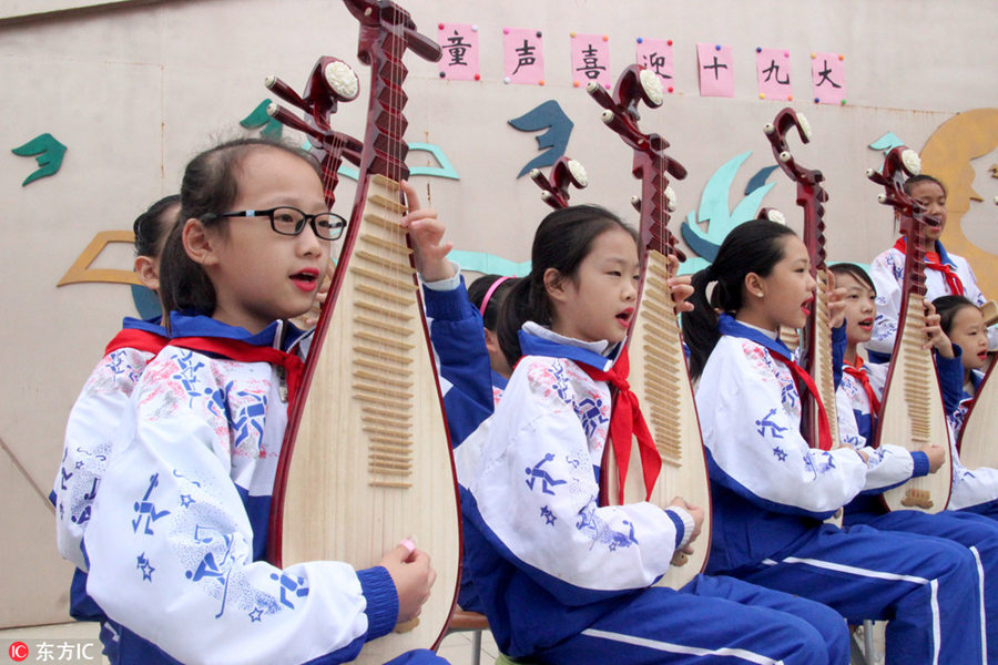 Students perform traditional Pingtan opera in Suzhou