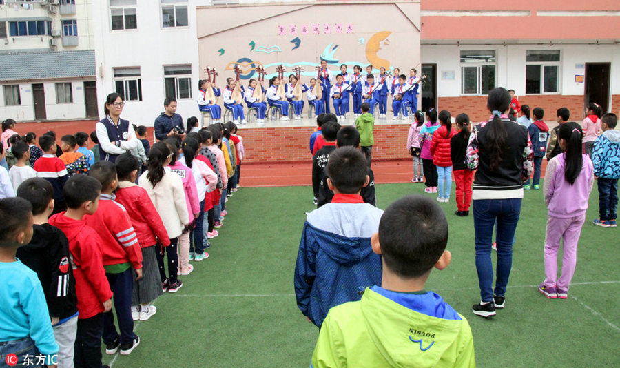 Students perform traditional Pingtan opera in Suzhou