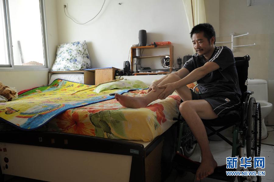 走近用微博掀起“蝴蝶效应”的“轮椅哥”周亚武