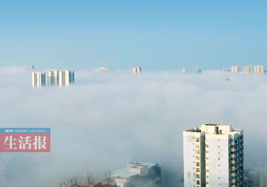 南宁市发布今年首个大雾橙色预警 雾里看城城更美