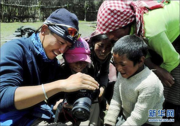 上海一志愿者单骑环中国边境线骑行爱心募款助