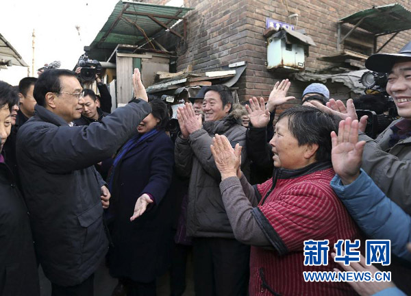 习近平李克强寒冬问民生