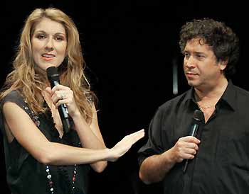 Canadian singer Celine Dion (L) talks to photog