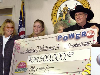 Powerball LOTTERY WINNER Andrew "Jack" Whittaker (R) holds a copy ...
