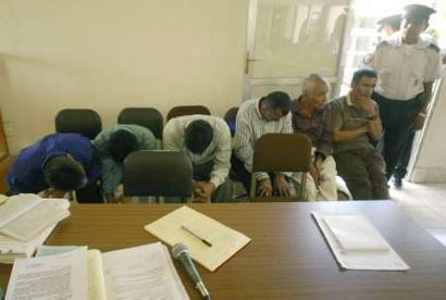 Former paramilitary fighters stand trial October 19, 2004 in Salama, Guatemala. The six men are accused of taking part in the army-led massacre of 143 Mayan women and children from the village of Rio Negro in central Guatemala's Maya Indian heartland in March 1982, during the country's long civil war.[Reuters]