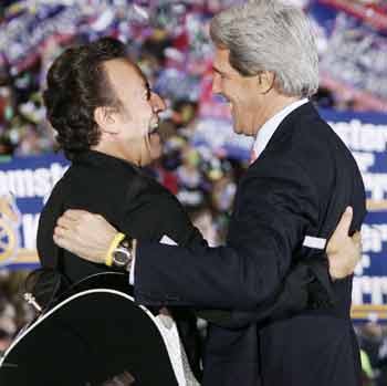 U.S. Democratic presidential nominee John Kerry (R) is greeted at a rally by musician Bruce Springsteen in Columbus, Ohio, October 28, 2004. There is less than one week remaining in the 2004 presidential campaign. [Reuters]