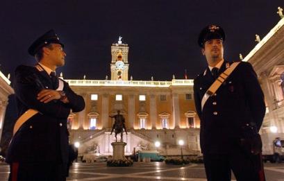Italian carabinieri patrol Rome's Capitoline Hill square, designed by Michelangelo, Thursday, Oct. 28, 2004, the night before the signing of the first ever EU Constitution. Representatives of 25 countries will sign the document after negotiations, which lasted 28 months, and were difficult, especially over whether the constitution should refer to Europe's Christian roots. The EU leaders approved the charter last June. [Reuters]