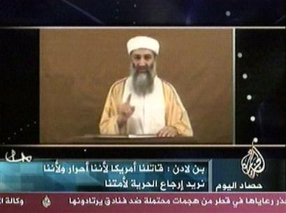 Osama bin Laden speaks in this image made from an undated video broadcast on Friday, Oct. 29, 2004 by Arab television station Al-Jazeera. In the statement, bin Laden directly admitted for the first time that he carried out the Sept. 11 attacks, and said 'the best way to avoid another Manhattan' was to stop threatening Muslims' security. Al-Jazeera, based in Qatar, did not say how it had received the tape. [AP]