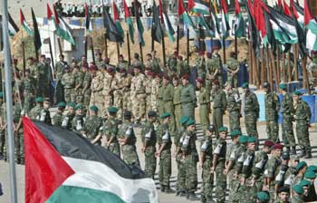 Palestinian honour guards stand in formation ahead of funeral of late Palestinian leader Yasser Arafat, inside Arafat's compound in the West Bank city of Ramallah on November 12, 2004. [Reuters]