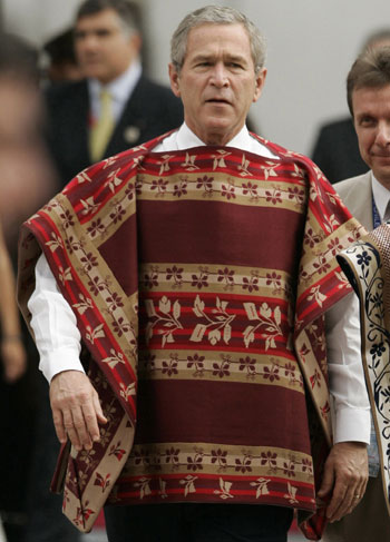U.S. President Bush wearing a traditional Chilean poncho 